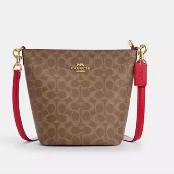 Coach Handbags - 🤎 Coach NWT Tan Logan Duffle Bag In Signature Canvas With Carnation Strap